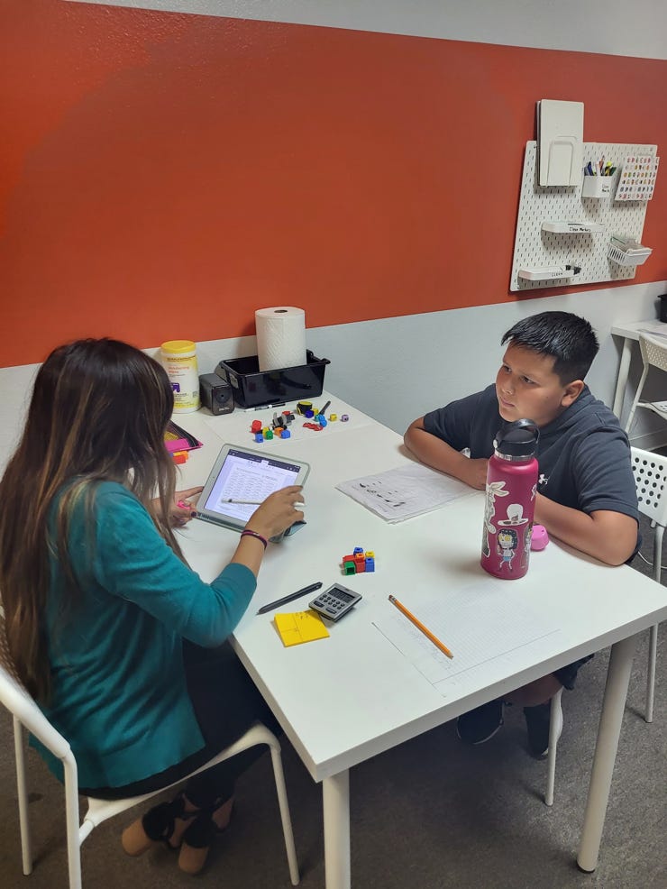 1-on-1 instructional interactions with a Fit Learning Coach and a male learner.