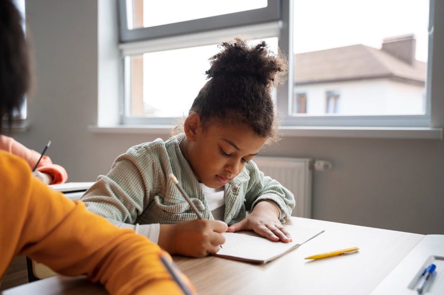 student doing work at a desk